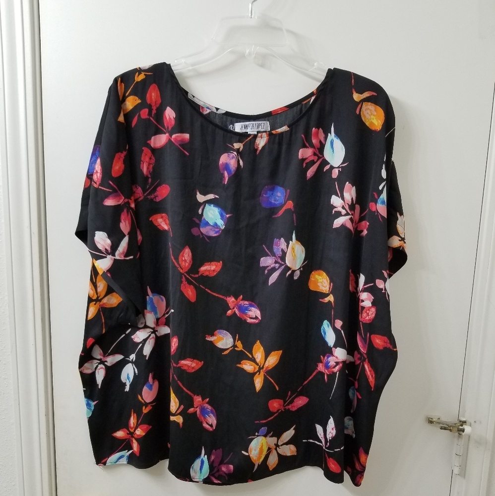 Jennifer Lopez black and floral blouse